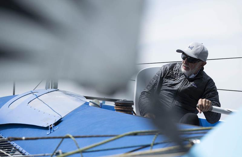 Peter Cunningham on the helm - Line honours for PowerPlay in the 90th Round the Island Race   photo copyright Lloyd Images / www.lloydimages.com taken at Island Sailing Club, Cowes and featuring the MOD70 class