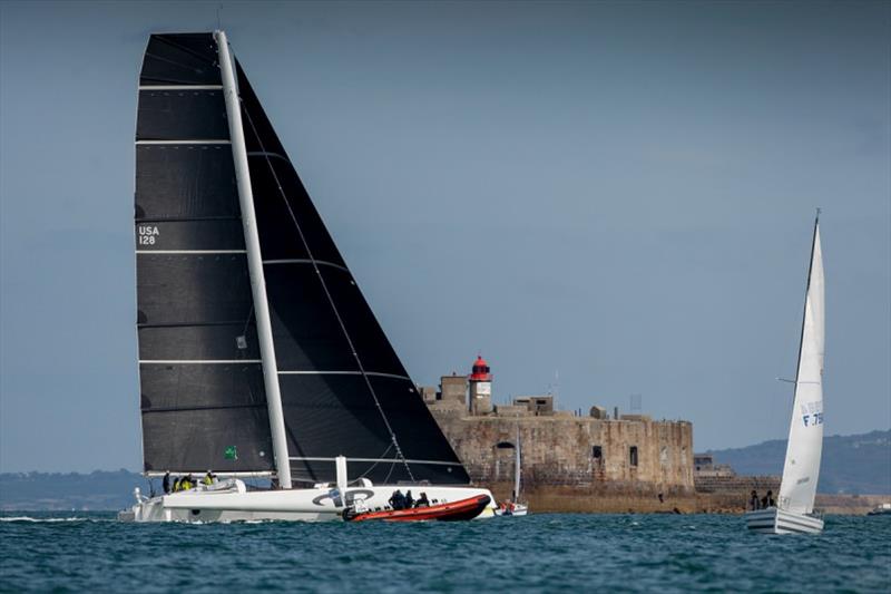 Jason Carroll's MOD70 Argo crosses the finish line off the light station on Fort De L'Ouest at 1522 BST photo copyright Paul Wyeth / pwpictures.com taken at Royal Ocean Racing Club and featuring the MOD70 class