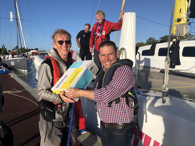 Matt Burnett (Gladstone Mayor) presenting beer to Rogntudjuuu - Brisbane to Gladstone Multihull Yacht Race photo copyright Chris Dewar taken at Multihull Yacht Club Queensland and featuring the MOD70 class