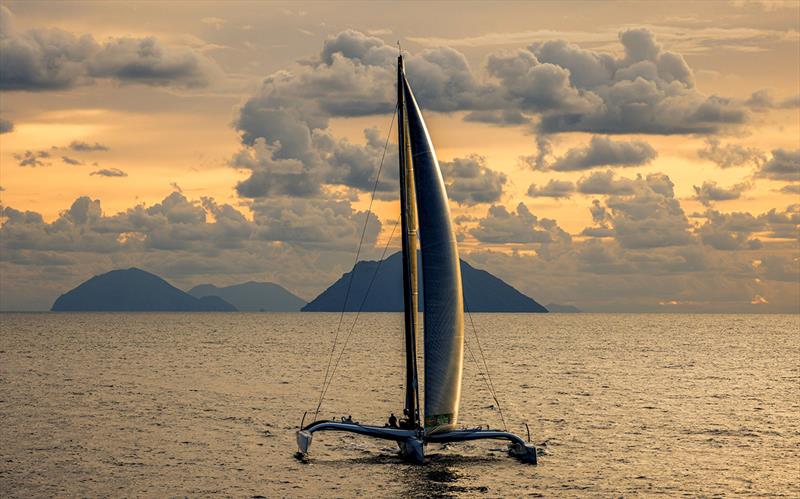 Riccardo Pavoncelli's MOD70 trimaran Mana passes the Aeolian Islands - Rolex Middle Sea Race photo copyright Rolex / Carlo Borlenghi taken at Royal Malta Yacht Club and featuring the MOD70 class