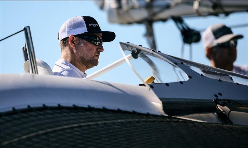 Jason Carroll on the helm or Argo photo copyright Robert Hajduk taken at Royal Ocean Racing Club and featuring the MOD70 class