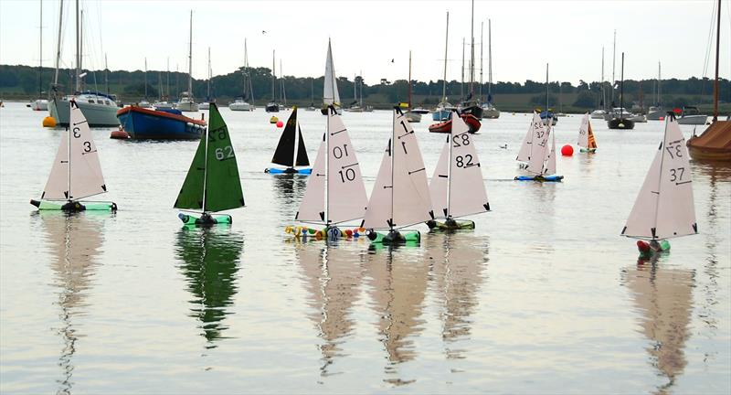 Elliott Mason 3 leading the fleet on the run during the 2025 BOTTLE boat championship at Waldringfield Sailing Club photo copyright Roger Stollery taken at Waldringfield Sailing Club and featuring the Model Yachting class