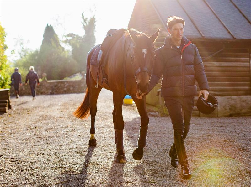 Harry Meade of Great Britain, ambassador for Musto, at his stud in Chipeenham photo copyright Tom Shaw for Musto taken at  and featuring the  class