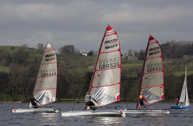 Musto Skiffs at the Ullswater Daffodil Regatta photo copyright Tim Olin / www.olinphoto.co.uk taken at Ullswater Yacht Club and featuring the Musto Skiff class