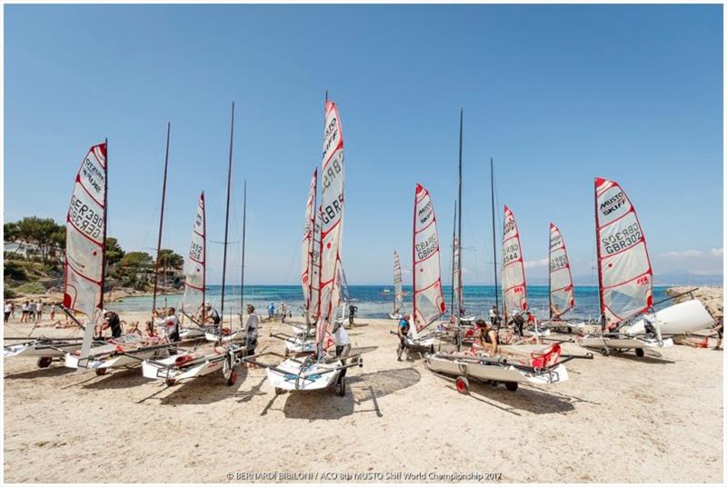 Musto Skiffs on beach at Palma photo copyright Bernardi Bibiloni taken at Club Nàutic S'Arenal and featuring the Musto Skiff class