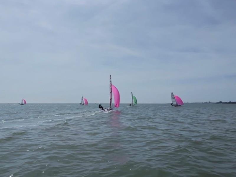 Musto Skiffs Training – Saturday - Fleet going downwind photo copyright Rebecca Bines taken at Brightlingsea Sailing Club and featuring the Musto Skiff class