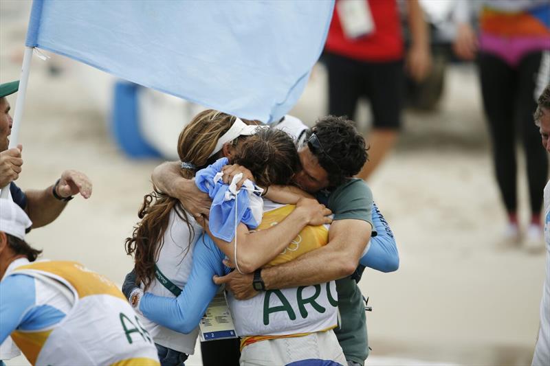 Cecilia Carranza Saroli enjoys the celebrations after winning gold in the Nacra 17 class at the Rio 2016 Olympic Sailing Competition photo copyright Sailing Energy / World Sailing taken at  and featuring the Nacra 17 class