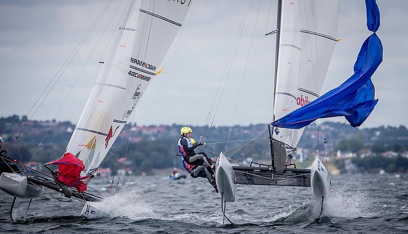 Lange/Saroli (ARG) (04) and Zajac/Matz (AUT) (05) - Nacra 17 - Day 4 - Hempel Sailing World Championships 2018, Aarhus, Denmark photo copyright Sailing Energy / World Sailing taken at  and featuring the Nacra 17 class