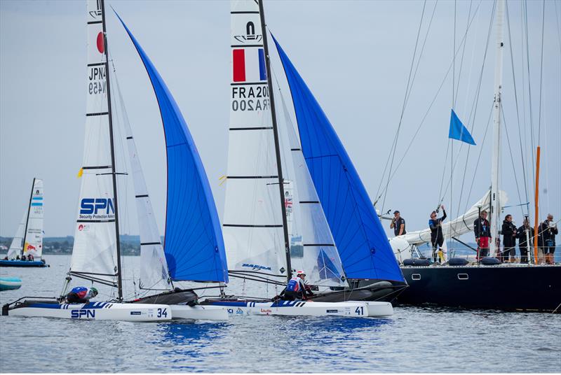 Controlled drift at the finish of the last race of the day - Nacra 17 - Hempel Sailing World Championships 2018 - Day 5 in Aarhus photo copyright Sailing Energy / World Sailing taken at  and featuring the Nacra 17 class