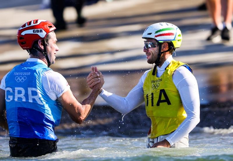 John Gimson (GBR - left) congratulates Ruggero Tita (ITA - right) while celebrating onshore photo copyright Sailing Energy / World Sailing taken at  and featuring the Nacra 17 class