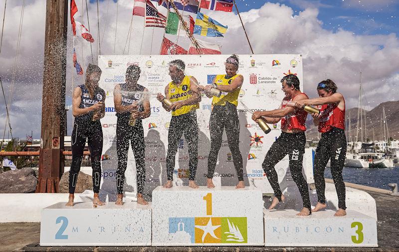 Nacra 17 Podium - Champagne battle between Argentina, France and New Zealand at the Lanzarote International Regatta photo copyright Sailing Energy taken at Lanzarote Sailing Center and featuring the Nacra 17 class