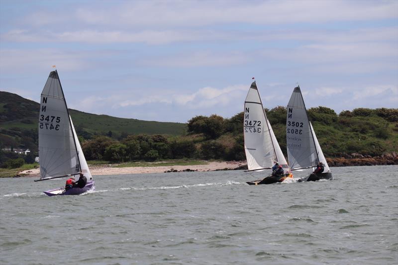 Tim and Christopher Hampshire, just ahead of eventual winners, Mark and Emma Simpson, Patrick Hamilton and Gayle Kaye close behind during the Solway Yacht Club June Open photo copyright Nicola McColm taken at Solway Yacht Club and featuring the National 12 class