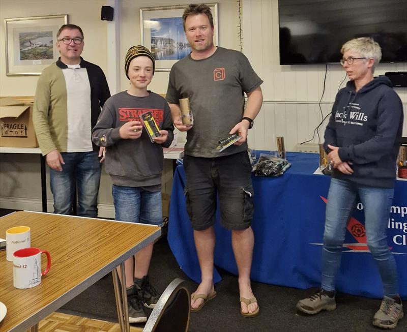 Non-foiler winners Rob and Harley Ford (centre) with Pete Miatt and Alex Gore presenting prizes for the Dinghy Shack National Series photo copyright Tom Stewart taken at Northampton Sailing Club and featuring the National 12 class