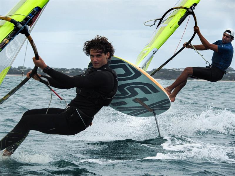Left- Romain Ghio (FRA), Right- Antonio Cozzolino (NZL) - 2020 RS:X Windsurfing World Championships, day 3 photo copyright Caitlin Baxter taken at Sorrento Sailing Couta Boat Club and featuring the RS:X class