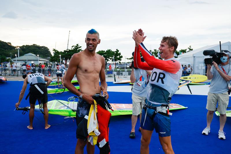 Kiran Badloe (NED) congratulated by rival competitor on Tokyo 2020 Olympic Sailing Competition Day 5 photo copyright Sailing Energy / World Sailing taken at  and featuring the RS:X class