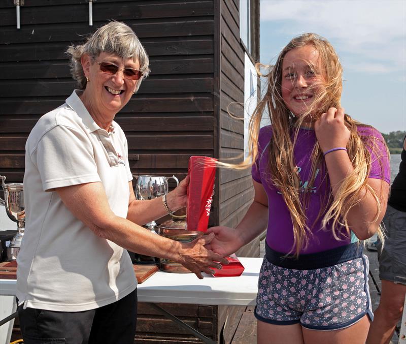 Elske Wilton receives her prize for 1st lady crew from Commodore Fil Daniels during the Norfolk Punt Championships at Barton Broad prize giving photo copyright Robin Myerscough taken at Norfolk Punt Club and featuring the Norfolk Punt class