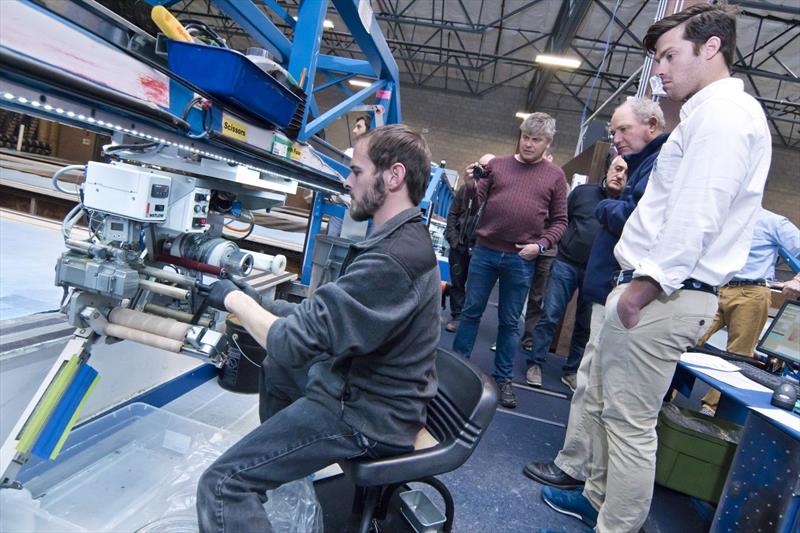 Shane Elliott, designer for TP52 Phoenix 2 and Grant Spanhake, watch as 3Di tapes are loaded into a tape head photo copyright North Sails taken at  and featuring the  class