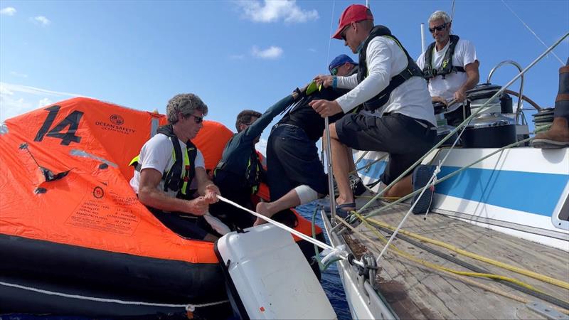 The crew of French OGR entrant Triana (66) FR assisted Stéphane Raguenes into the liferaft before being winched onboard the helicopter and flown to Madeira for medical attention photo copyright OGR 2023 / Margault Demasles taken at  and featuring the Ocean Globe Race class