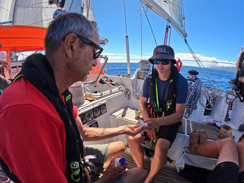 Doctor Patrick taking care of Peter who got up too close and personal with a spinnaker pole – and that was before the spinnaker wrap! photo copyright Team Explorer / OGR2023 taken at  and featuring the Ocean Globe Race class