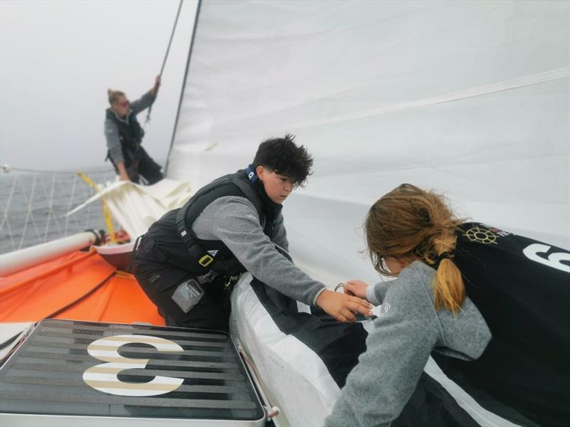 Hard at work changing sails on Maiden during leg 1 of the Ocean Globe Race photo copyright Maiden / OGR2023 taken at  and featuring the Ocean Globe Race class