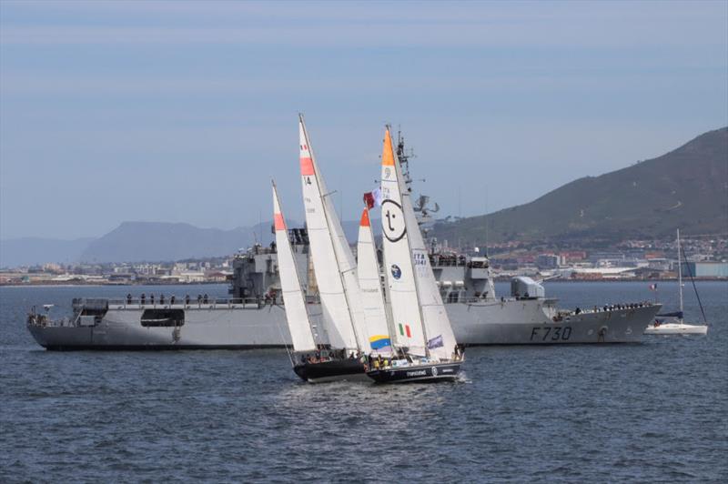 Jockeying for position at the start line under the watchful eye of the French Frigate Floréal - 2023 Ocean Globe Race Leg 2 photo copyright OGR2023 / Marco Ausderau taken at  and featuring the Ocean Globe Race class