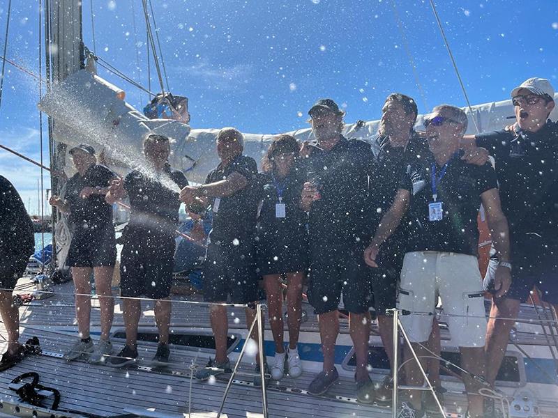 The first of many bottles of champagne no doubt consumed by the friends onboard Evrika to celebrate their success - Ocean Globe Race 2023 photo copyright OGR2023 / Jacqueline Kavanagh taken at  and featuring the Ocean Globe Race class