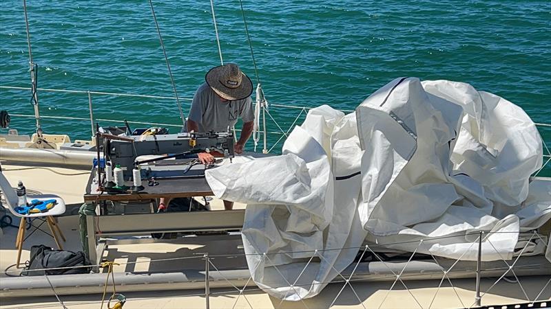 Sail repairs on the foredeck of Pen Duick VI - Ocean Globe Race - Auckland - January 2024 - photo © Richard Gladwell - Sail-World.com/nz