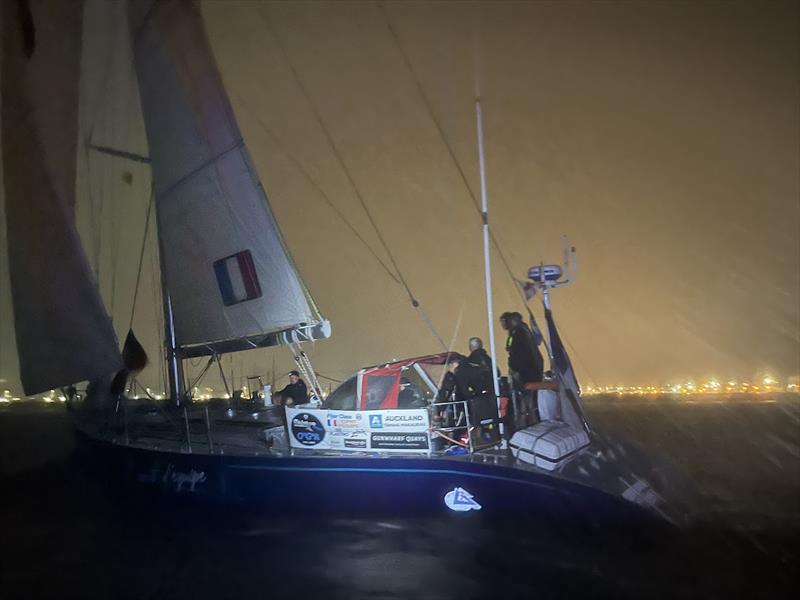 A rainy, nighttime arrival for the former Whitbread winner, L'Esprit d'équipe FR (85) - photo © Jacqueline Kavanagh / OGR2023