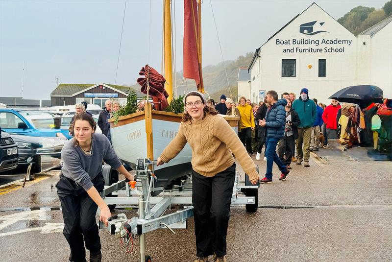 BBA graduate boat builder Katherine Briggs (right) leads her boat 'Campion' to Lyme Regis harbour - photo © Debbie Granville