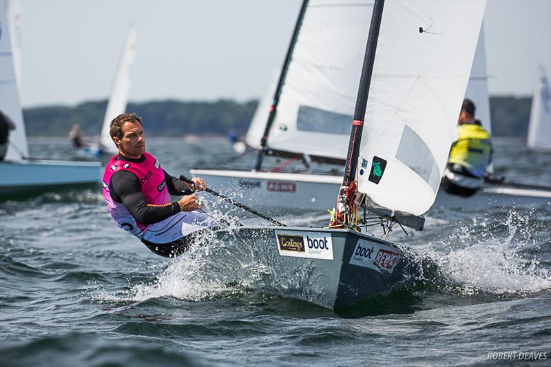 Valerian Lebrun on day 3 of the OK Dinghy European Championship in Kiel, Germany photo copyright Robert Deaves taken at  and featuring the OK class