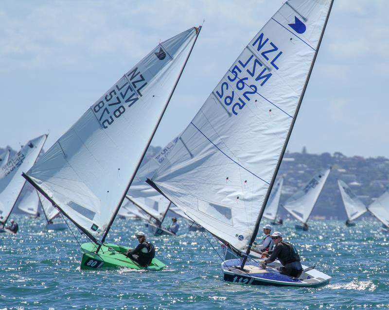 Luke O'Connell (578) and Dan Slater  (562) contest the lead - Symonite OK World Championships - Day 1, February 10, 2019 photo copyright Richard Gladwell taken at Wakatere Boating Club and featuring the OK class
