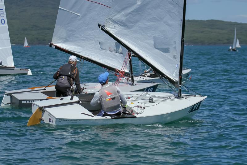 Jan Kurfeld dicing with Rod Davis - Symonite OK World Championships - Day 1, February 10, 2019 photo copyright Richard Gladwell taken at Wakatere Boating Club and featuring the OK class