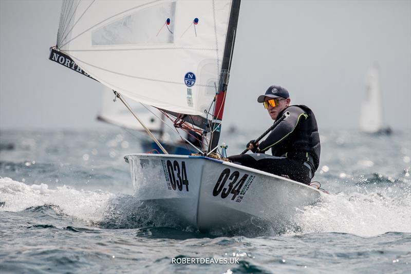 OK Dinghy Worlds Day 1 - Charlie Cumbley, GBR photo copyright Robert Deaves / www.robertdeaves.uk taken at Lyme Regis Sailing Club and featuring the OK class