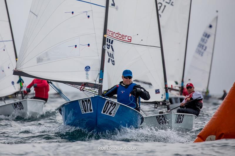 OK Dinghy Worlds Day 1 - Russ Clark, GBR photo copyright Robert Deaves / www.robertdeaves.uk taken at Lyme Regis Sailing Club and featuring the OK class