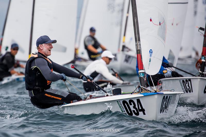 OK Dinghy Worlds Day 3 - Charlie Cumbley, GBR photo copyright Robert Deaves / www.robertdeaves.uk taken at Lyme Regis Sailing Club and featuring the OK class