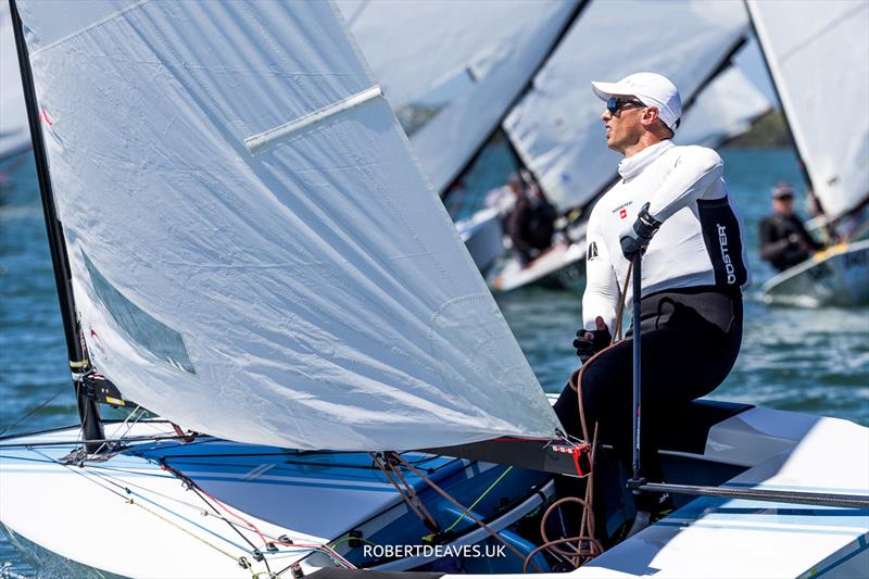 Steve McDowell, NZL on day 1 of the 2024 OK Dinghy World Championship Brisbane photo copyright Robert Deaves / www.robertdeaves.uk taken at Royal Queensland Yacht Squadron and featuring the OK class