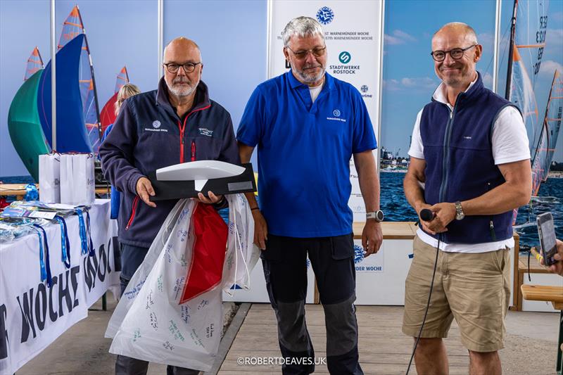 Peter Ramcke, PRO, Jan Prockat, course race officer, presented with a signed flag and half model by Pontus Gäbel from OKDIA - OK Dinghy Europeans at Warnemünde - photo © Robert Deaves / www.robertdeaves.uk
