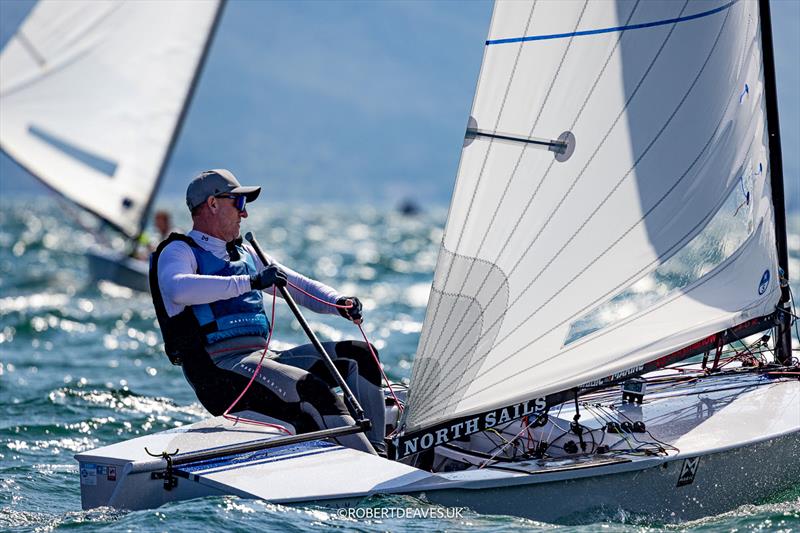 OK Dinghy Worlds at Lake Garda Day 1 - Charlie Cumbley, GBR photo copyright Robert Deaves / www.robertdeaves.uk taken at Circolo Vela Arco and featuring the OK class