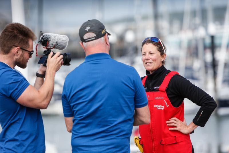Sam Davies is interviewed on the dock after arriving in Plymouth in the Rolex Fastnet Race photo copyright RORC / Paul Wyeth taken at Royal Ocean Racing Club and featuring the IMOCA class