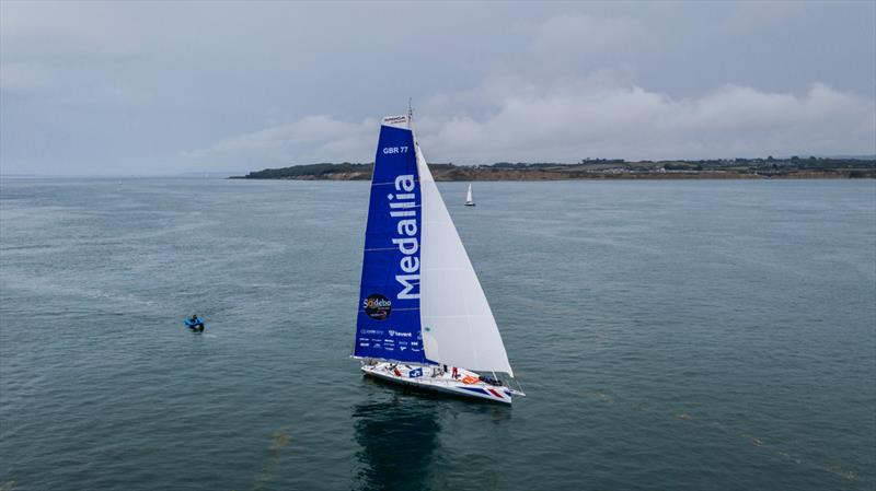 Medallia starts the Lonely Rock Race photo copyright Richard Langdon / www.oceanimages.co.uk taken at  and featuring the IMOCA class