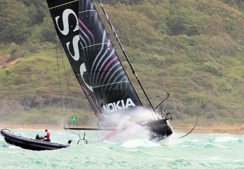 Hugo Boss passes Hurst Castle after the Rolex Fastnet Race start photo copyright Mark Jardine taken at Royal Ocean Racing Club and featuring the IMOCA class