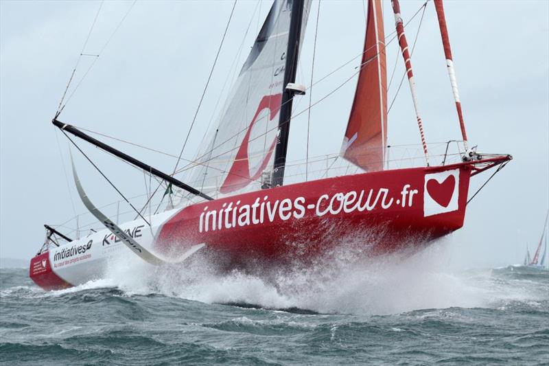 Sam Davies' IMOCA Initiatives Coeurs blasts her way out of the Solent  in the Rolex Fastnet Race photo copyright Rick Tomlinson / www.rick-tomlinson.com taken at Royal Ocean Racing Club and featuring the IMOCA class