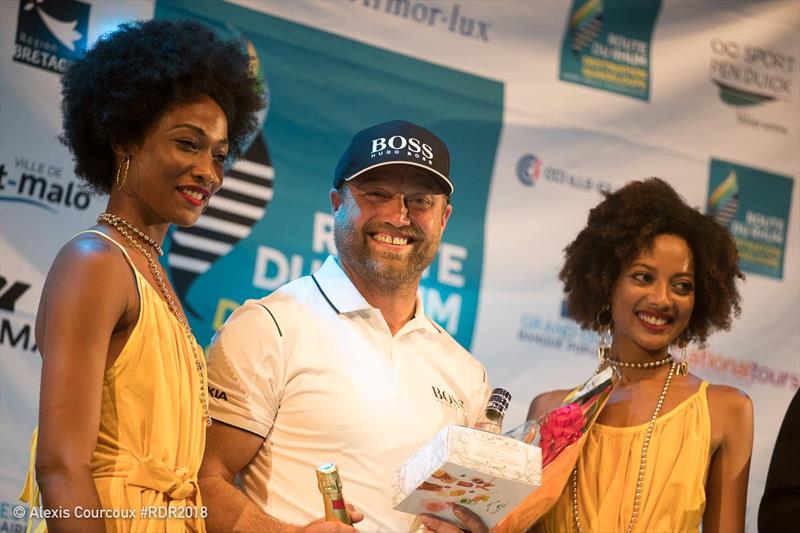 A smiling Alex Thomson - even coming second has its compensations photo copyright Alexis Courcoux taken at  and featuring the IMOCA class