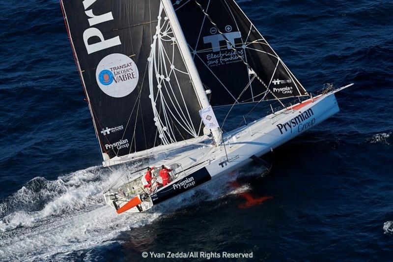 Giancarlo Pedote crosses the finish line of the Transat Jacques Vabre photo copyright Yvan Zedda taken at  and featuring the IMOCA class