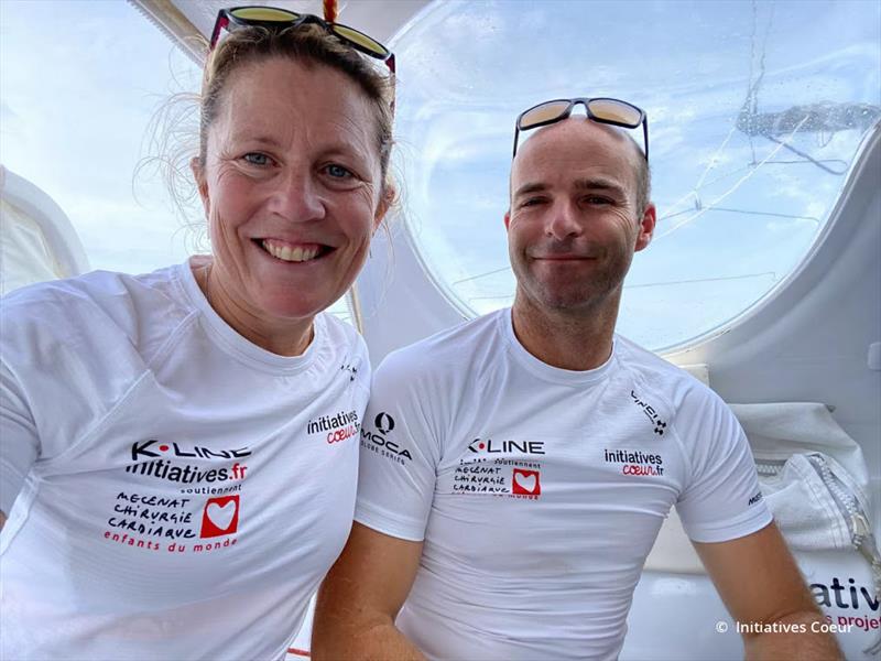 Sam Davies and Nicolas Lunven solve a wardrobe malfunction in the Transat Jacques Vabre - photo © Initiatives-Coeur