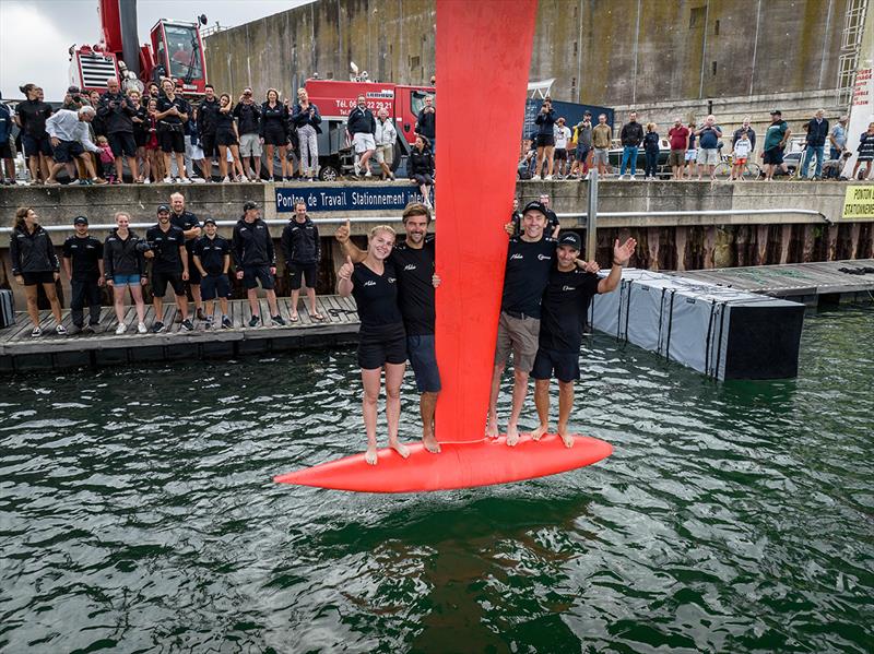 Team Malizia's sailing crew standing on the keel of their new boat, Malizia - Seaexplorer -  - The Ocean Race - photo © Yann Riou - polaRYSE