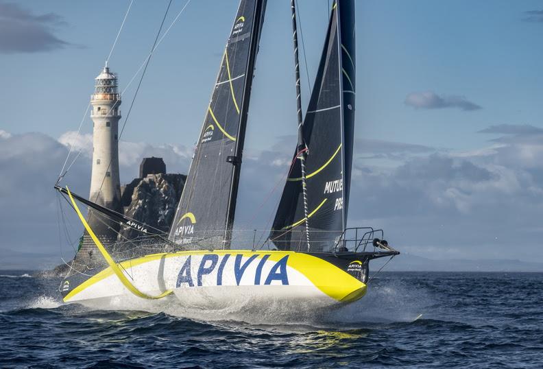 The IMOCA 60 Apivia at the emblematic Fastnet Rock in the 2021 Rolex Fastnet Race photo copyright Kurt Arrigo / Rolex taken at Royal Ocean Racing Club and featuring the IMOCA class