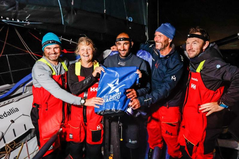 Pip Hare's IMOCA Medallia takes line honours in the Sevenstar Round Britain and Ireland Race photo copyright Paul Wyeth / pwpictures.com taken at Royal Ocean Racing Club and featuring the IMOCA class