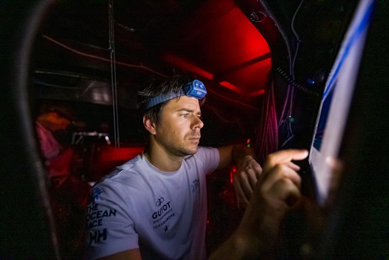 28 January 2023, Leg 2 day 4 onboard GUYOT environnement - Team Europe. Sébastien Simon studying the info at the screens - photo © Charles Drapeau / GUYOT environnement - Team Europe