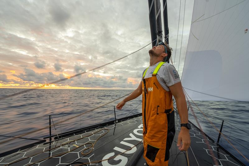 3 February 2023, Leg 2, Day 10 onboard GUYOT environnement - Team Europe. Phillip Kasüske on the bow at sunrise photo copyright Charles Drapeau / GUYOT environnement - Team Europe taken at  and featuring the IMOCA class